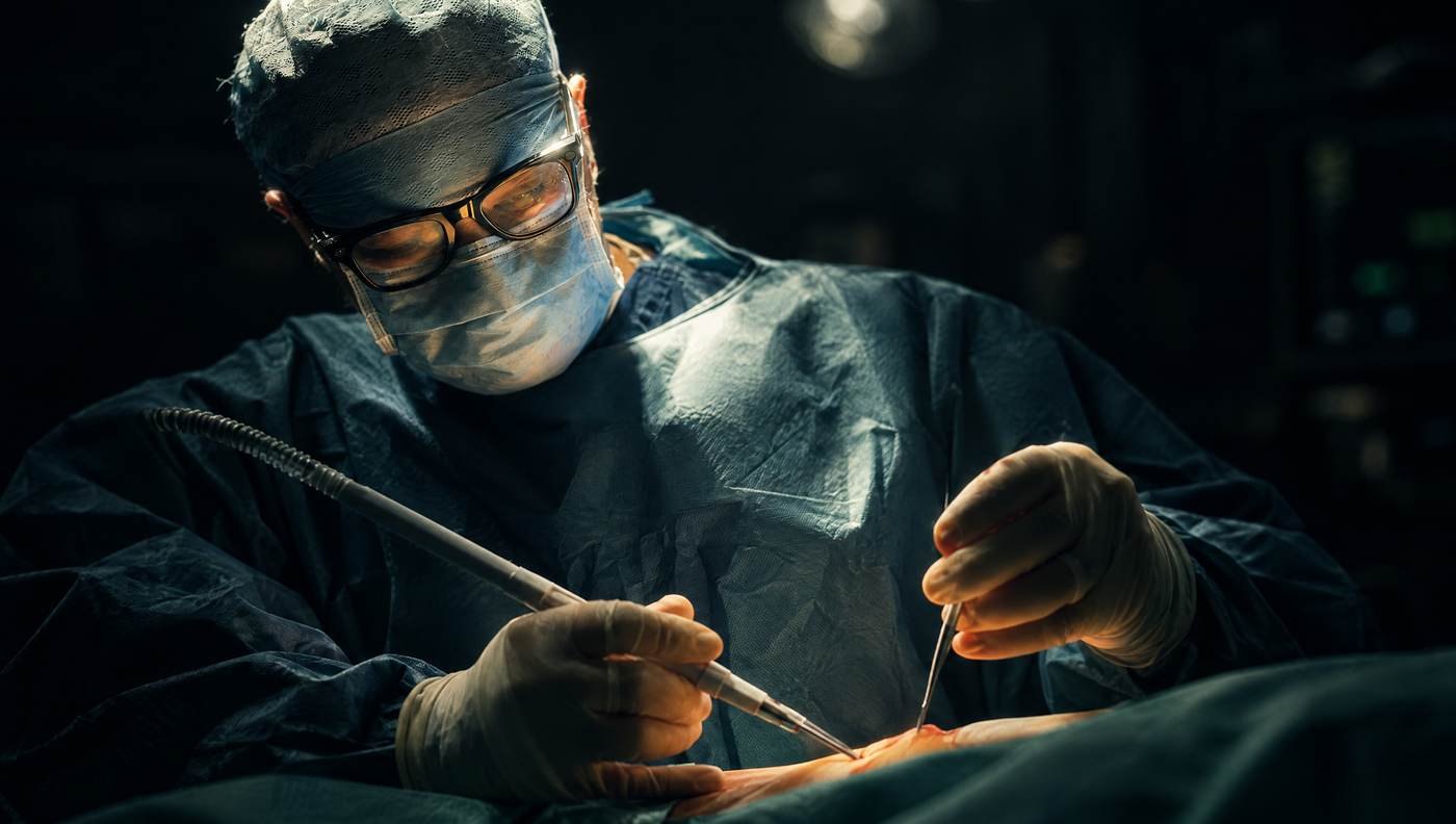 Mr Reza Nassab, Consultant Plastic Surgeon, in theatre